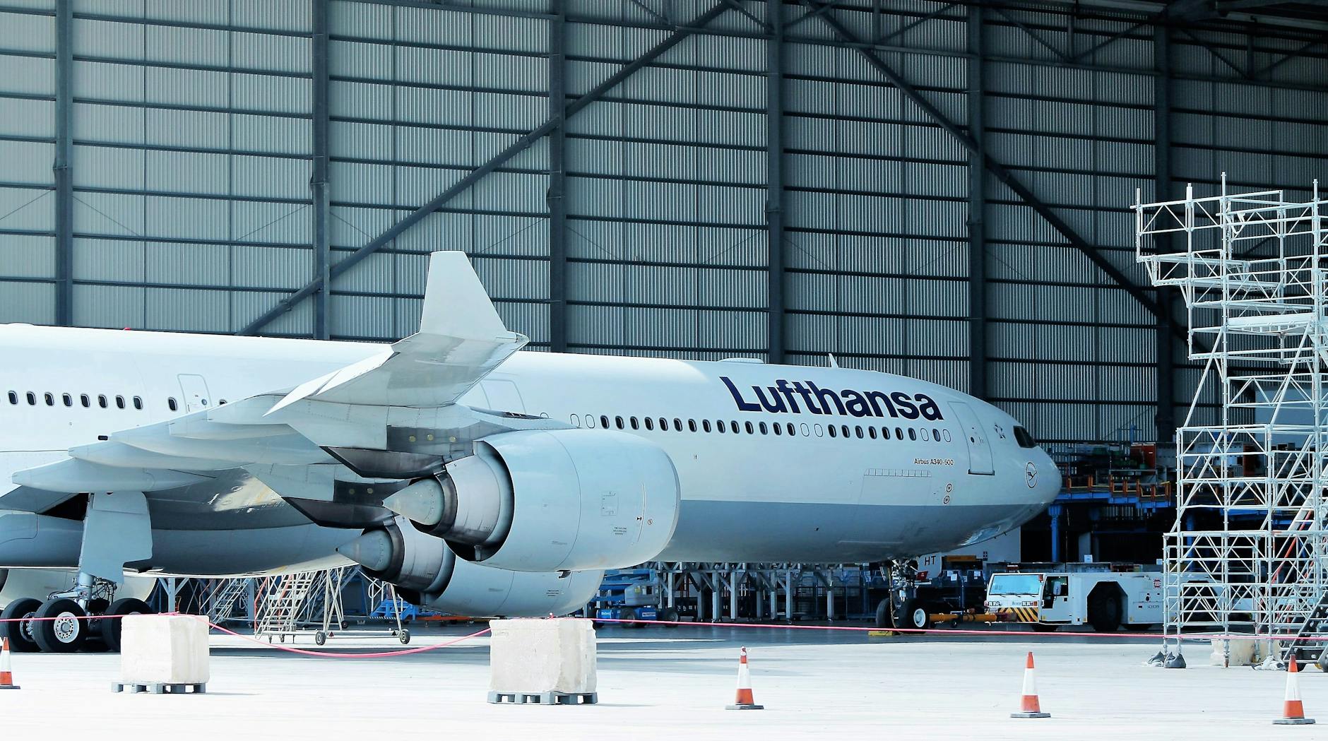 Lufthansa airplane under maintenance in hangar at Malta Airport.